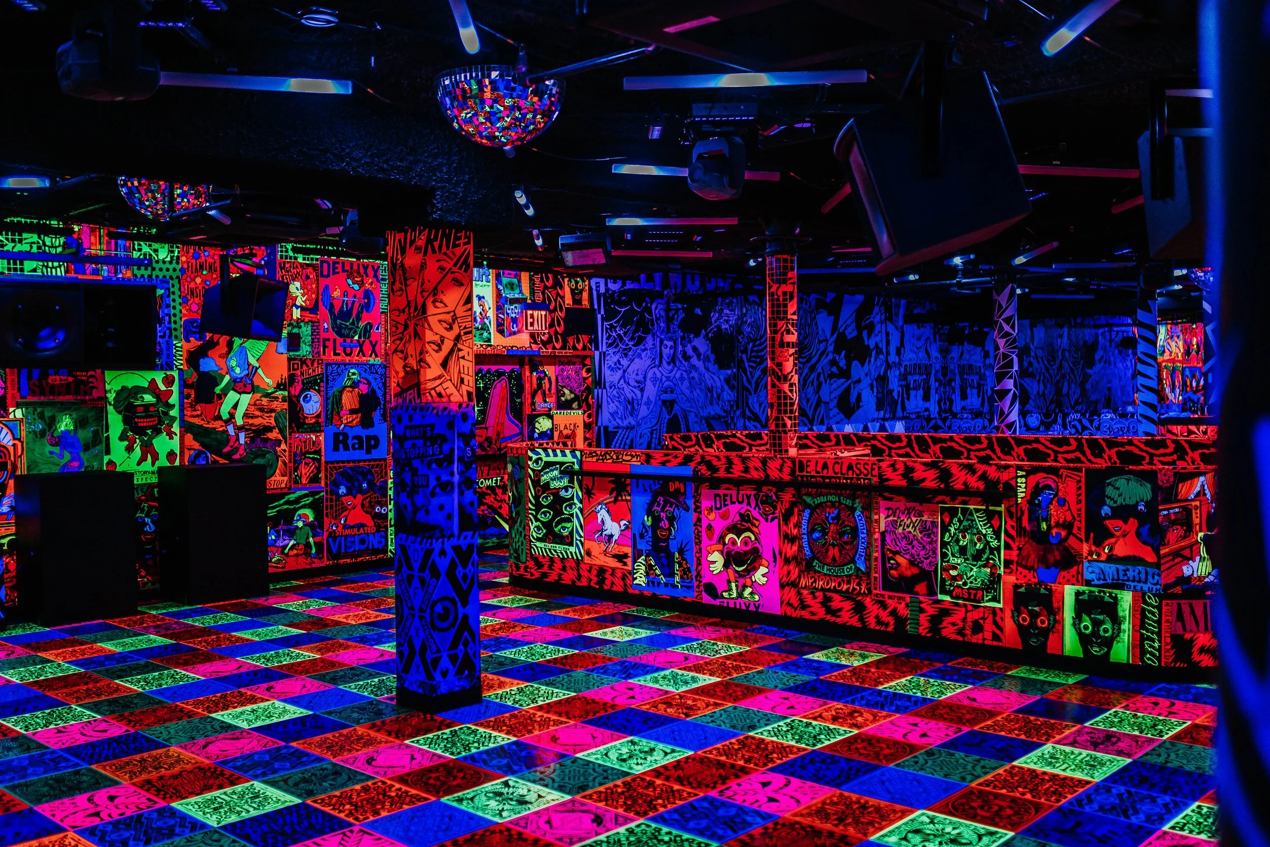 The black-light dance floor at Deluxx Fluxx, New York