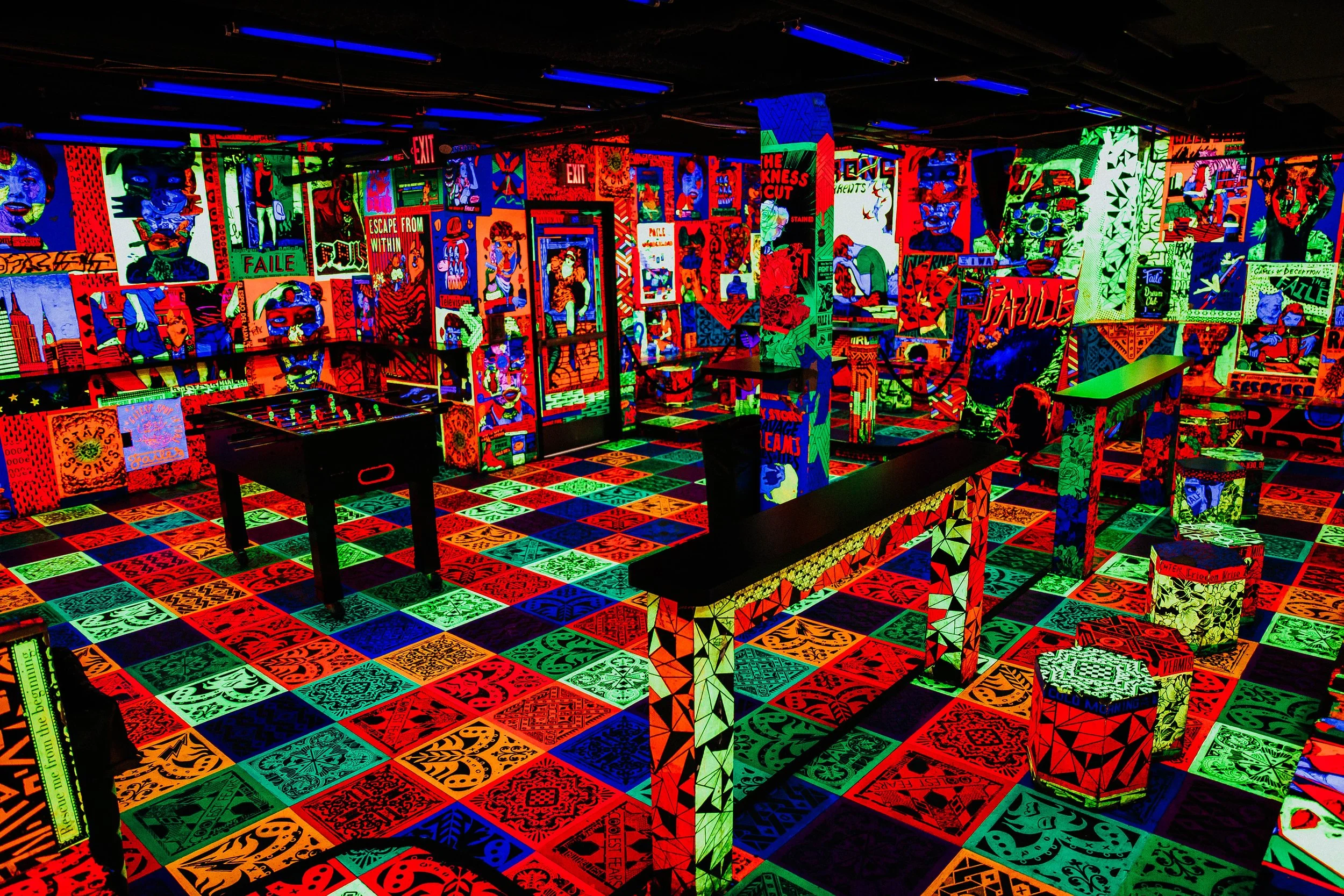 The back room at Deluxx Fluxx, New York, with foosball tables