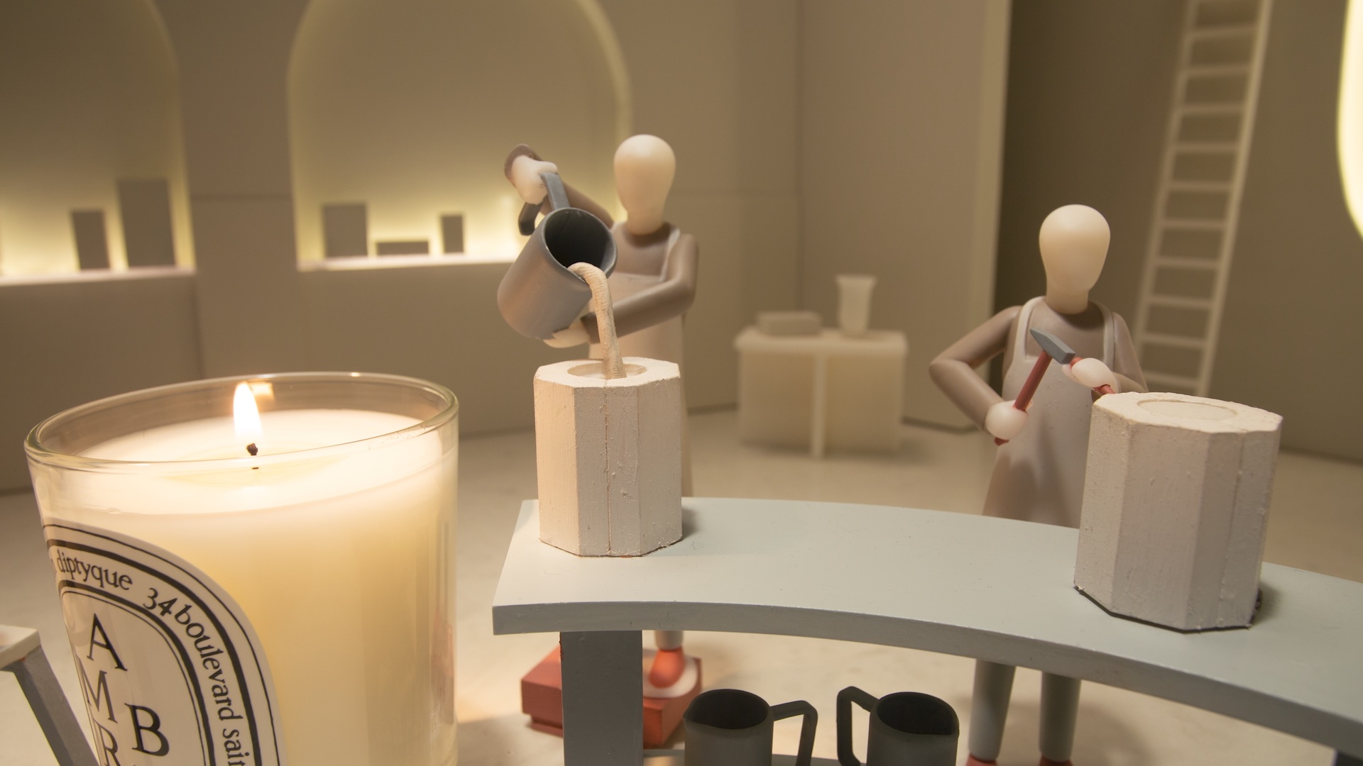Miniature artisans pour wax into a mold in Chris Ullens’ Diptyque Médicis film