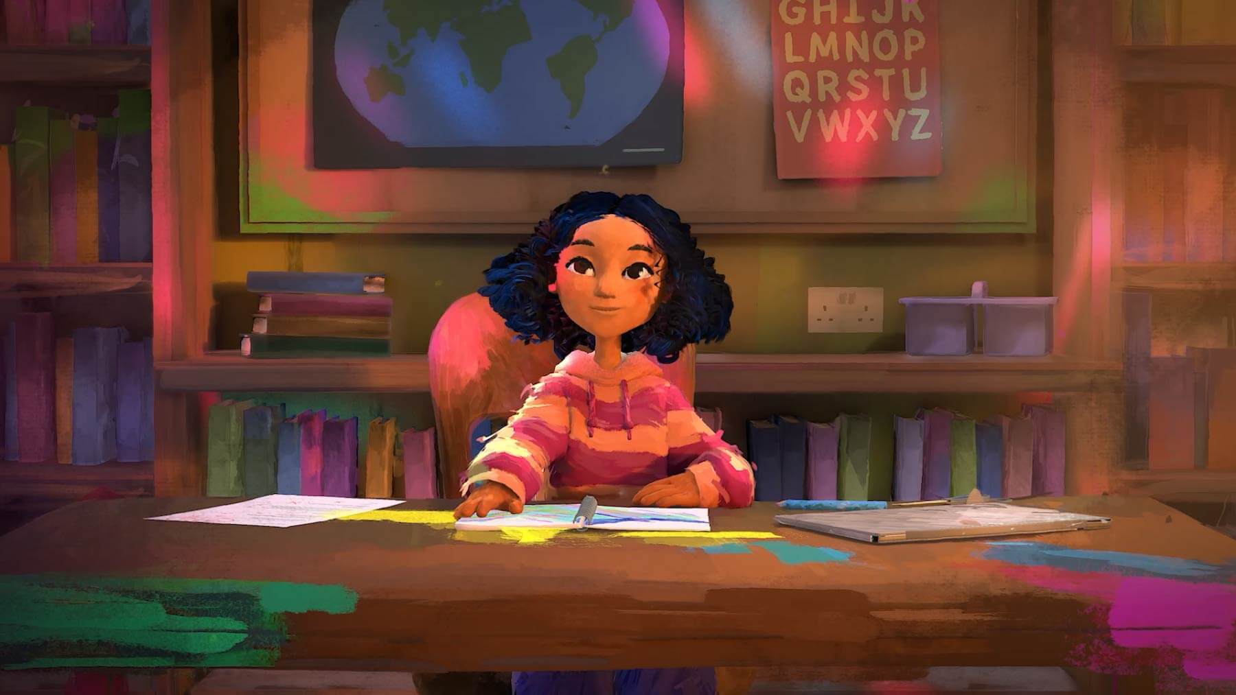 Lola sits at a desk surrounded by colourful books and drawings in What Is Dyslexia?